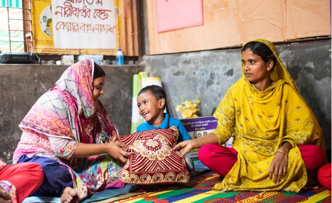 two women and a child laughing